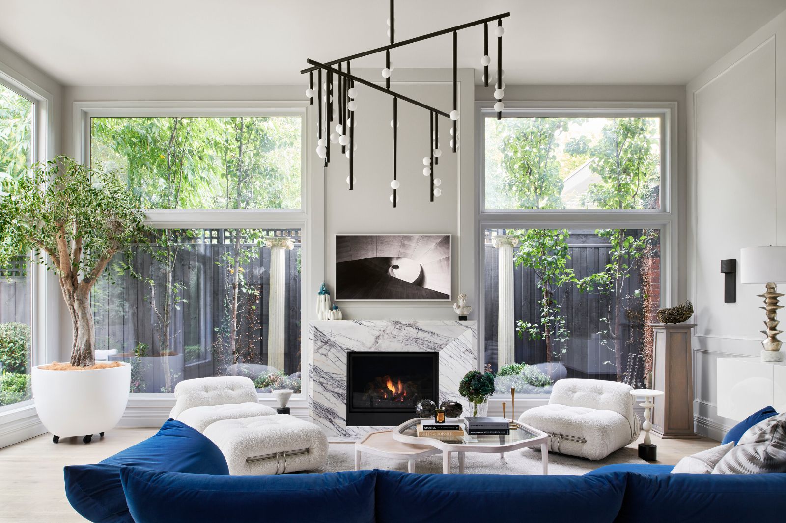 Alphington living room with a linear pendant hanging above the sofa and fireplace