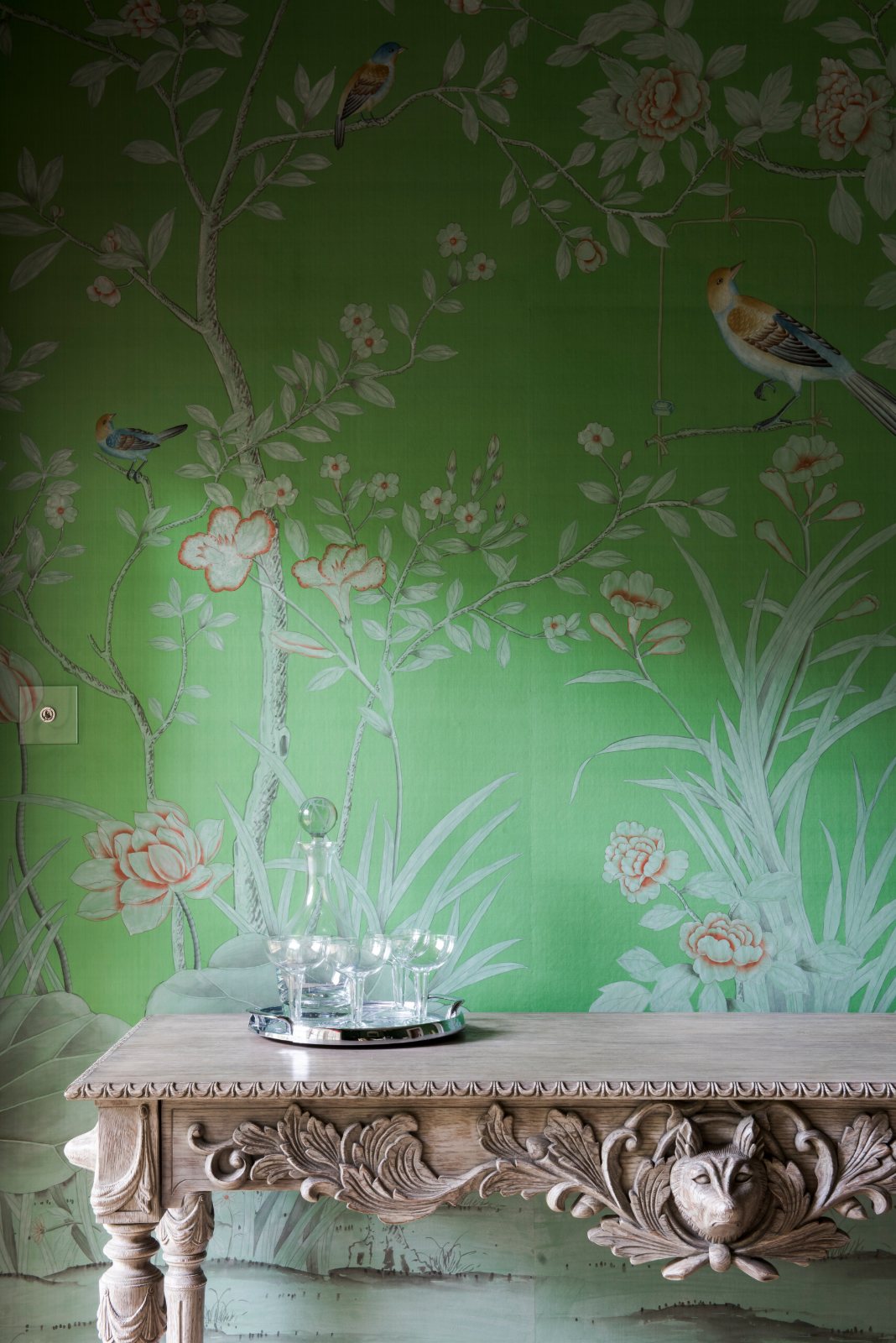 East Melbourne Period console in carved timber against green floral wallpaper
