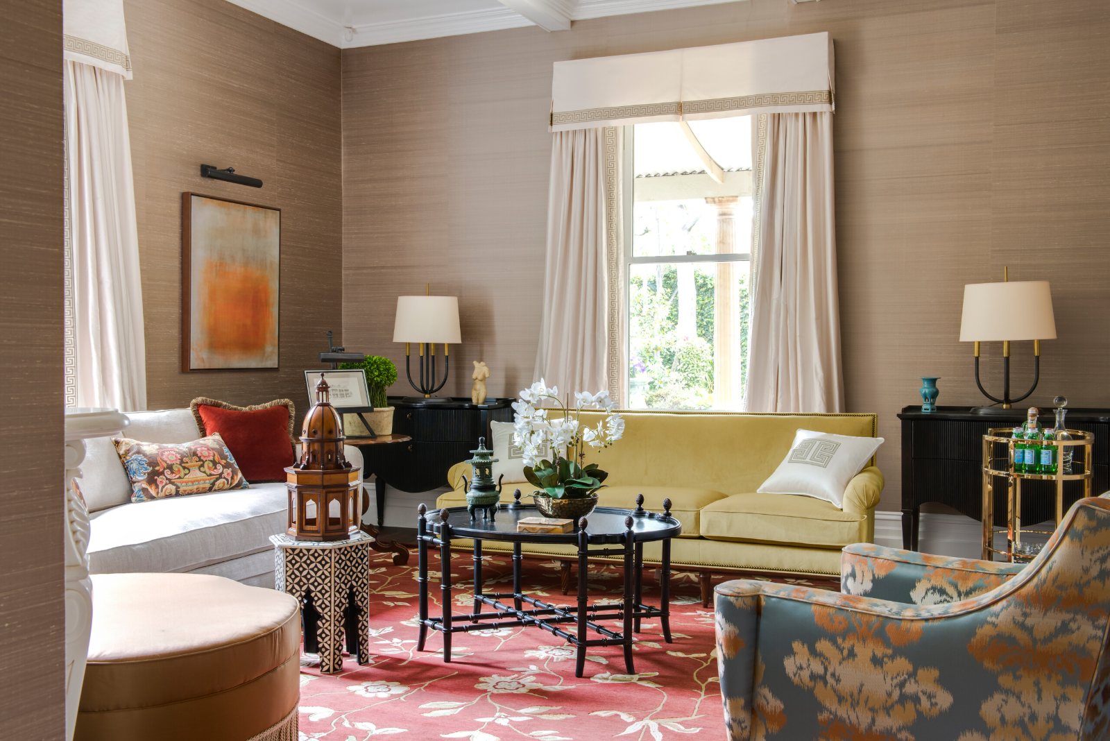East Melbourne Period sitting room with a yellow sofa, armchairs and a red rug