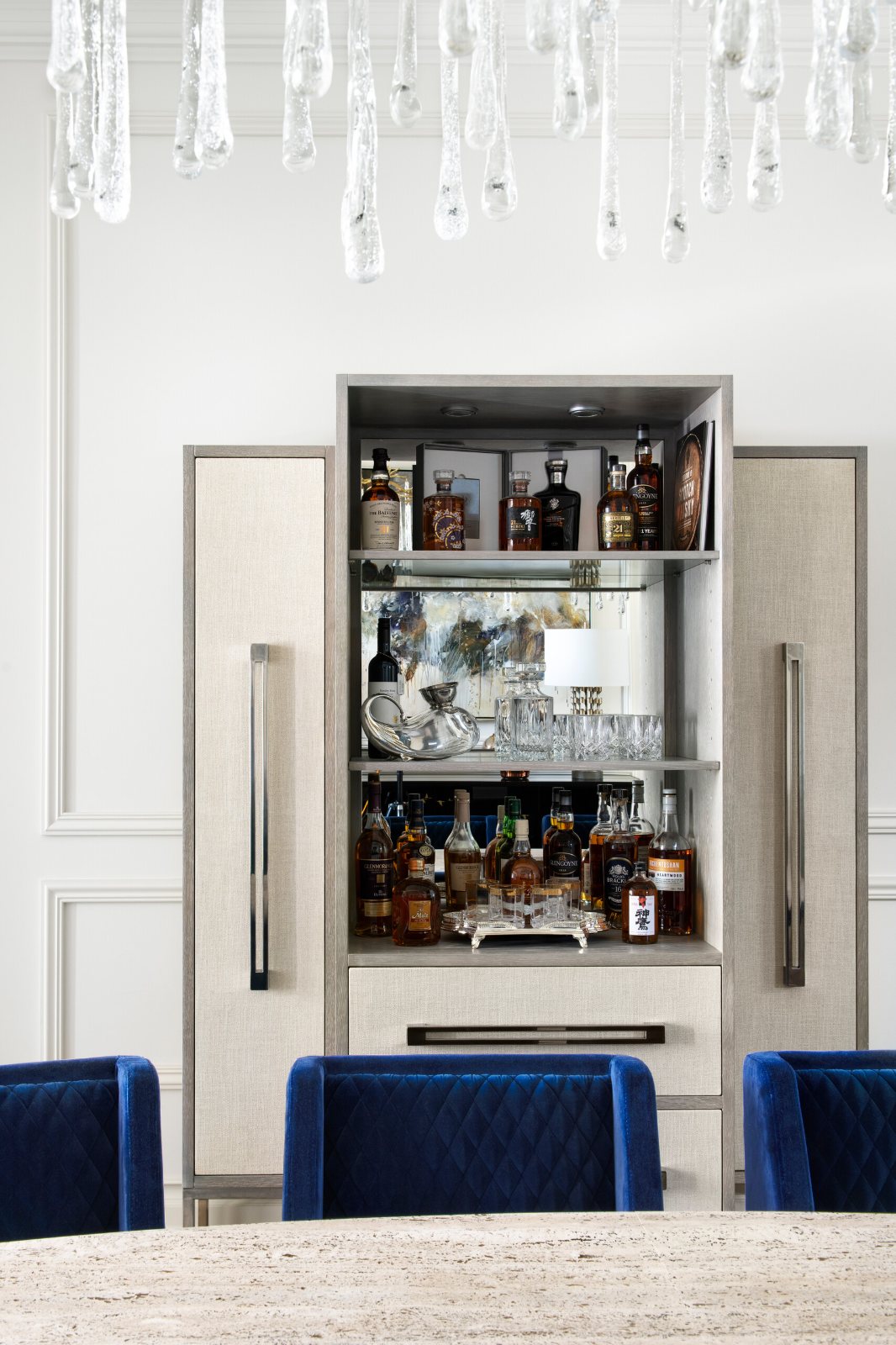 Kew, Alfred Street bar cabinet with open shelves of bottles and glasses
